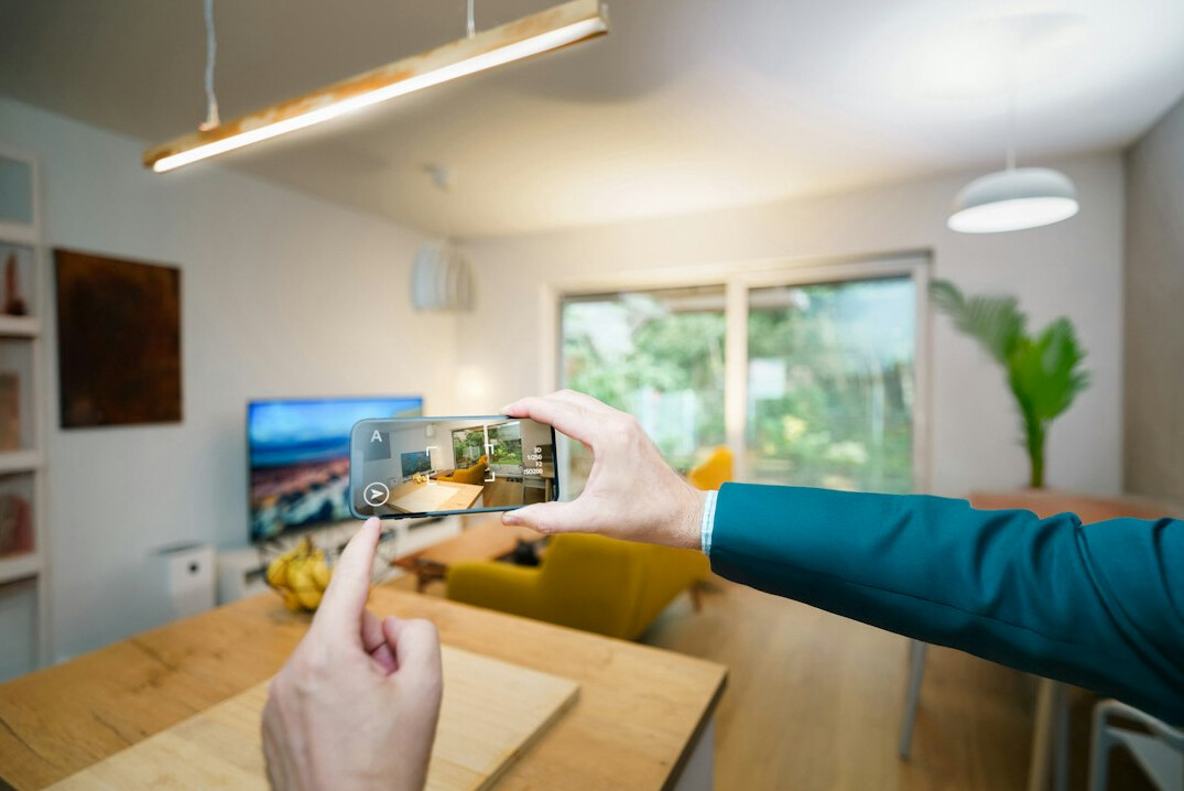 person scrolling smartphone at home