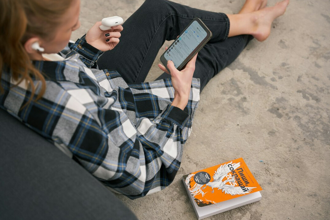 person reading book instead of phone