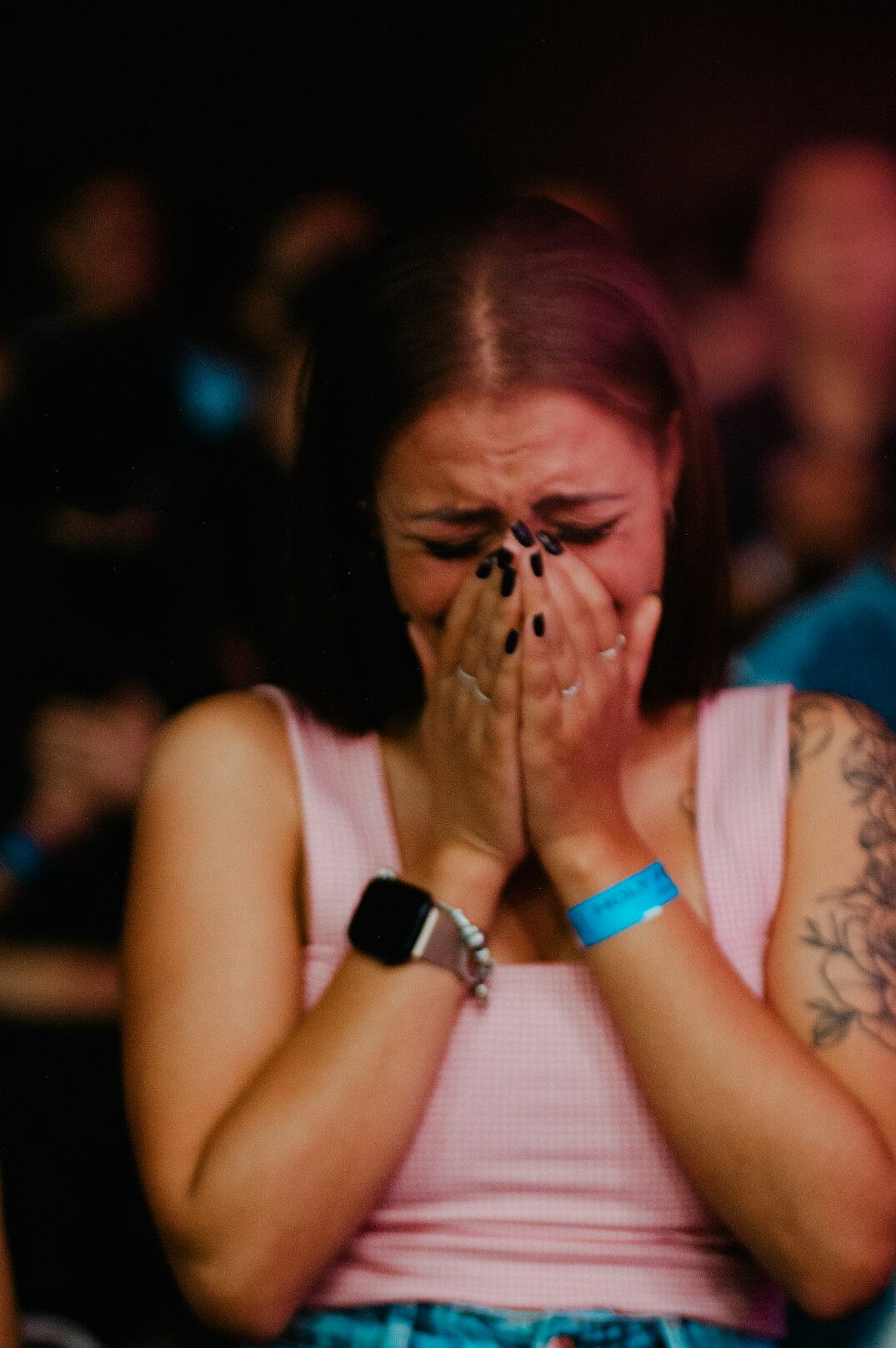 person feeling stressed in crowd