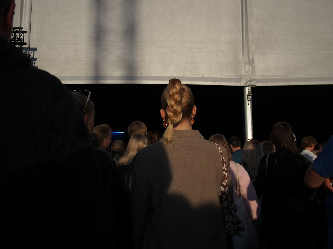 person standing alone in crowd