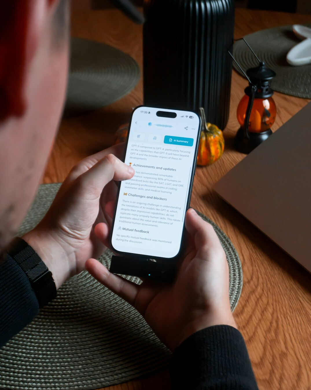 person scrolling smartphone at home
