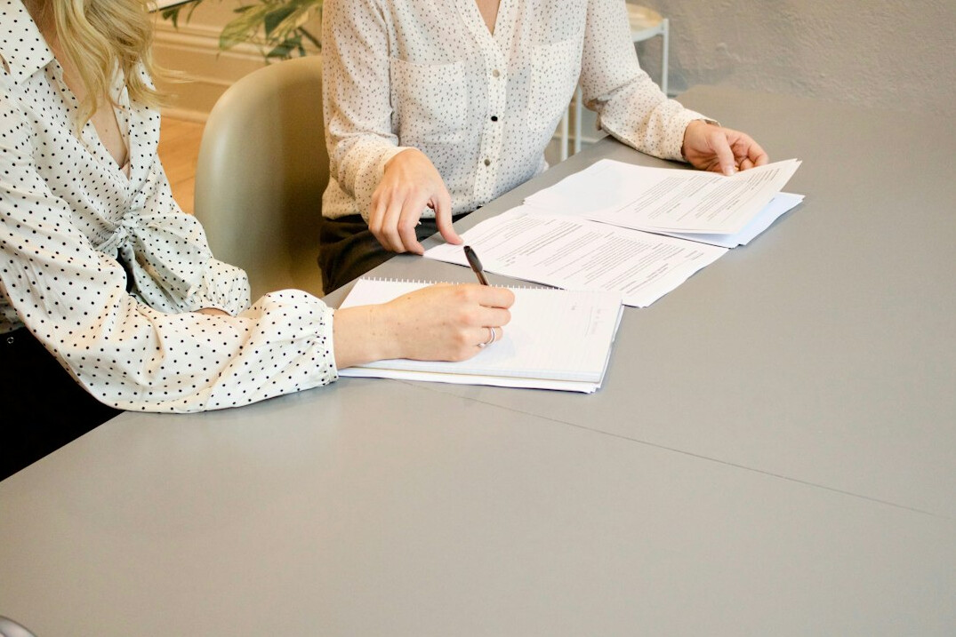 people filling out survey forms
